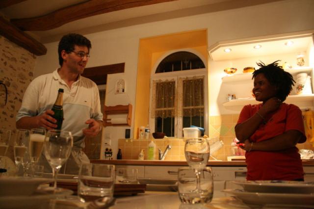 France, 80km east of Paris - Our host, Laurent chatting with   Nakia about the local Champagne he has just opened for us!