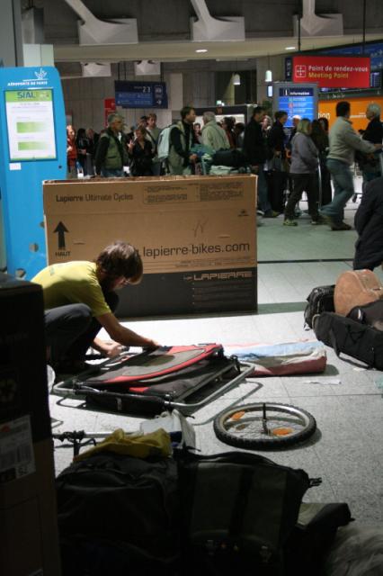 Paris, France, Charles DeGaule airport - Pete packing up the Bandwagon. Its always stressful to pack up the bikes and our gear w