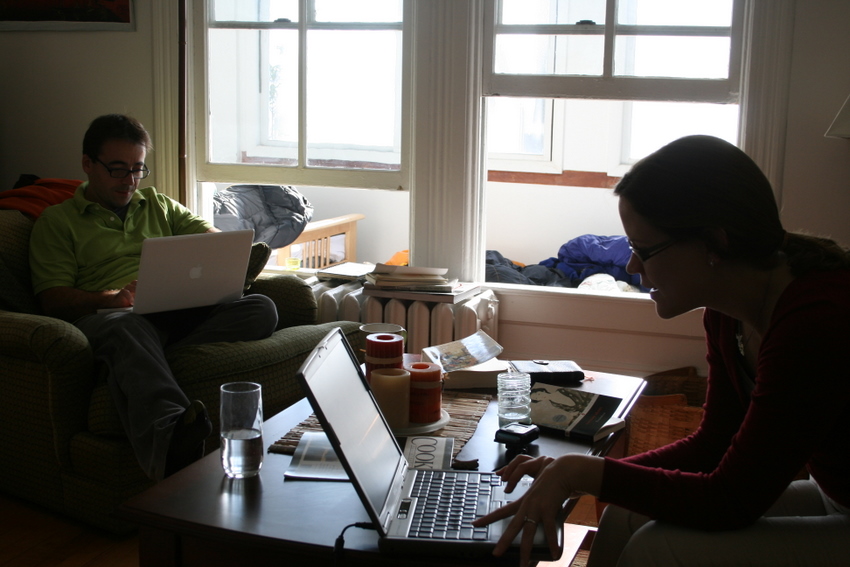 USA, Madison, Wisconsin - Jen and Xavier connected to the World Wide Web in their apartment 