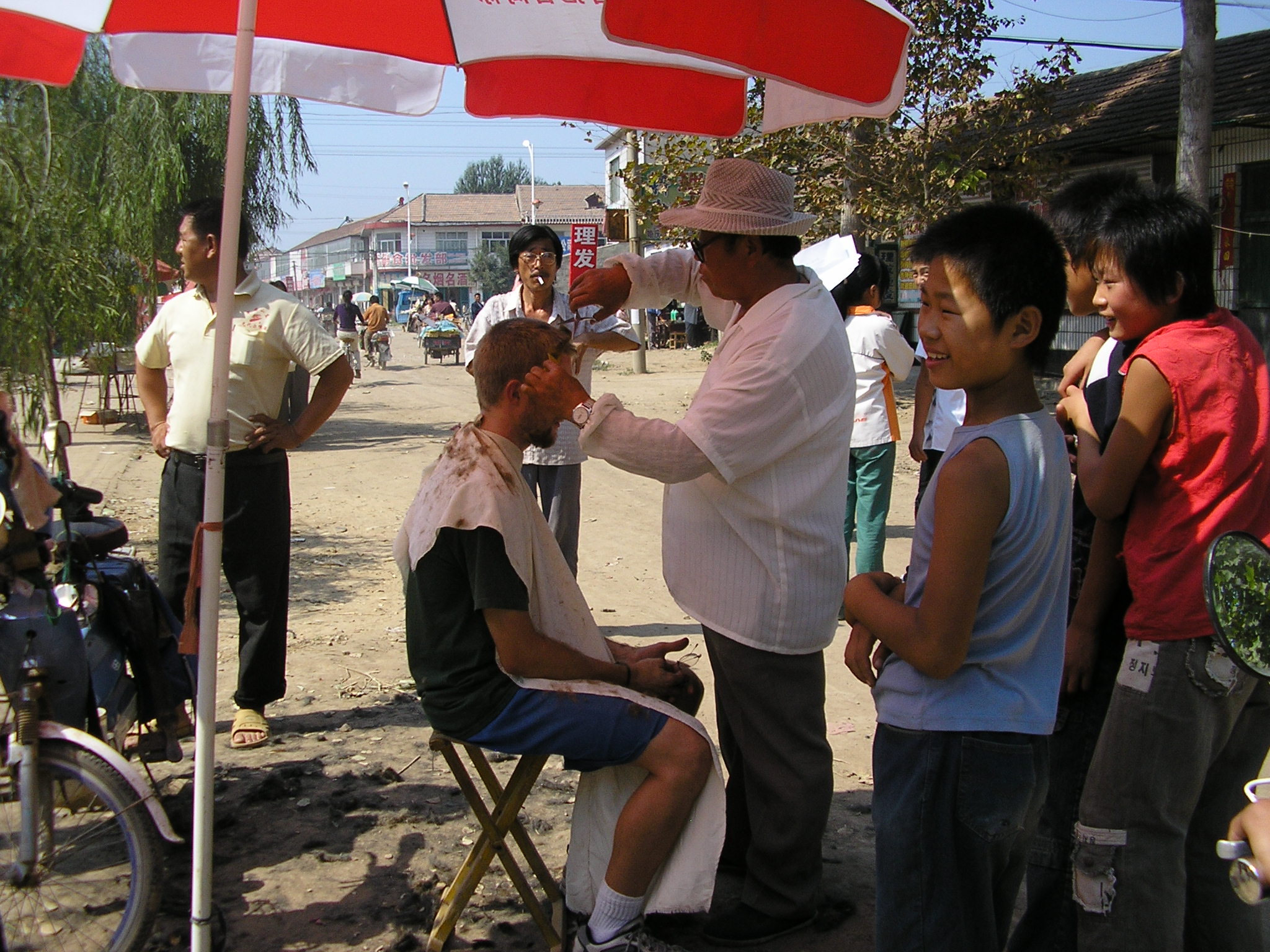 China - Drew getting his only haircut of the year