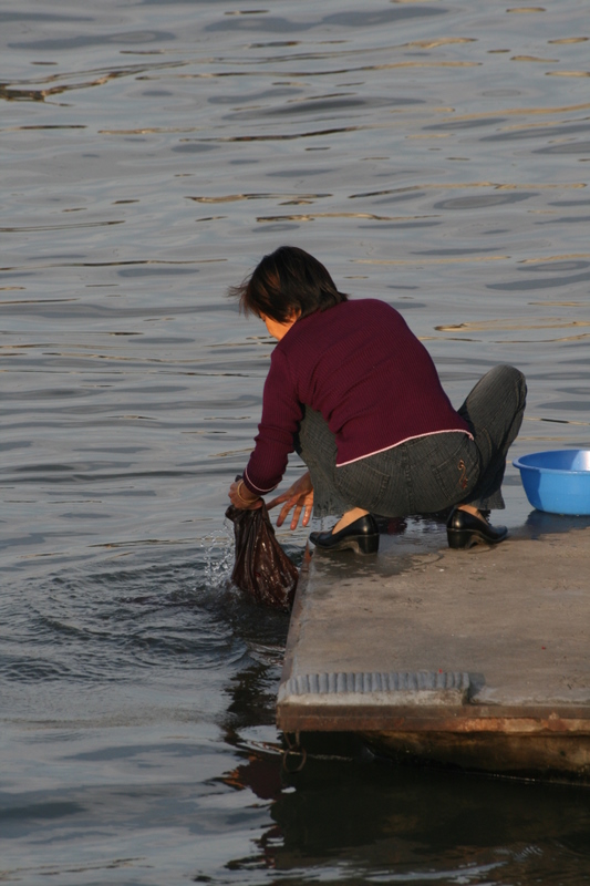 Oct 9 2007 - Changrong village, Jiangsu Prov, China. Morning. Washing clothes by hand is very common in China outside of middle 