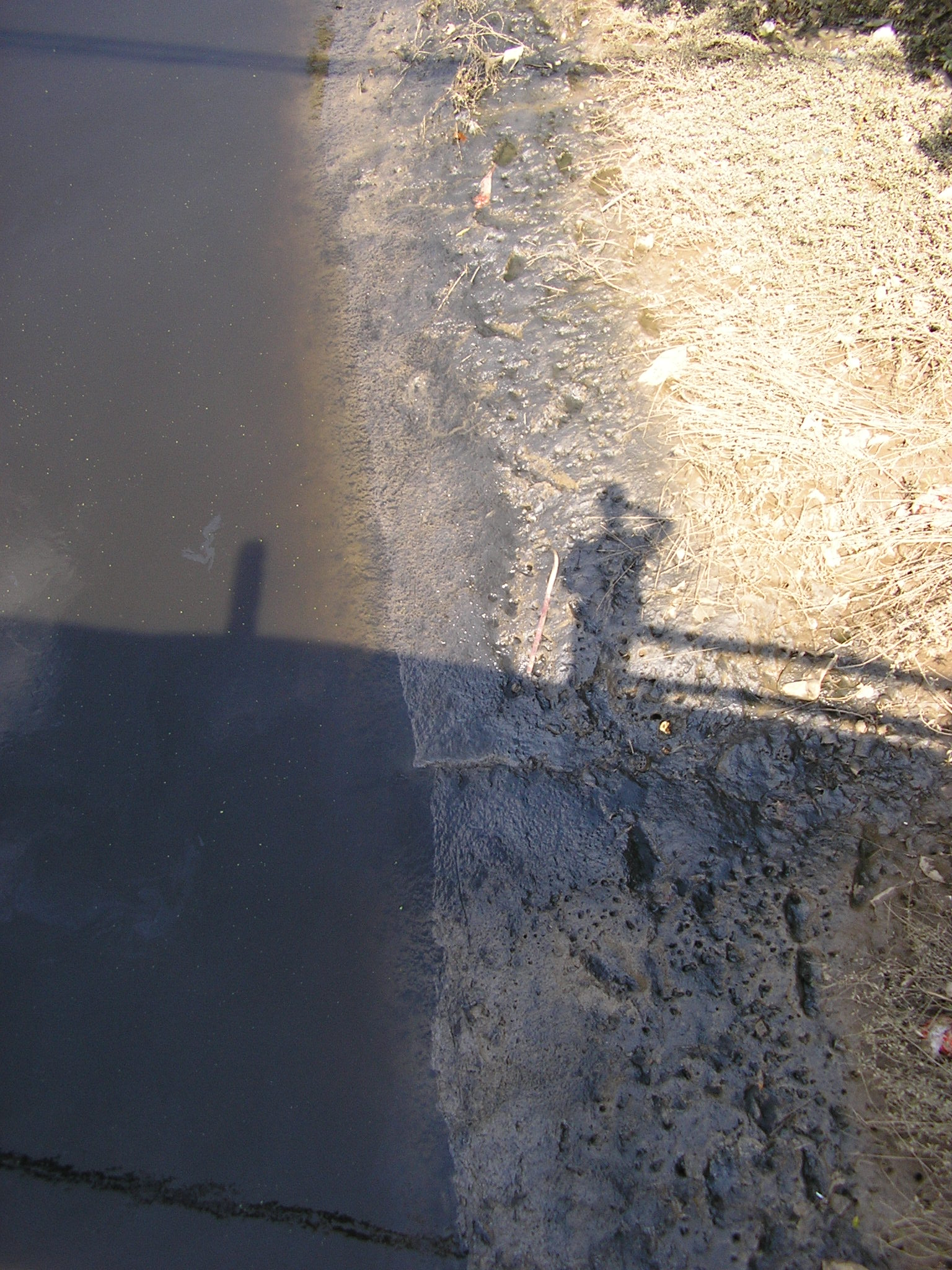 Oct 2007 - Part water, large part disel fuel and other chemicals, this creek flows unfiltered into the Yangze River.