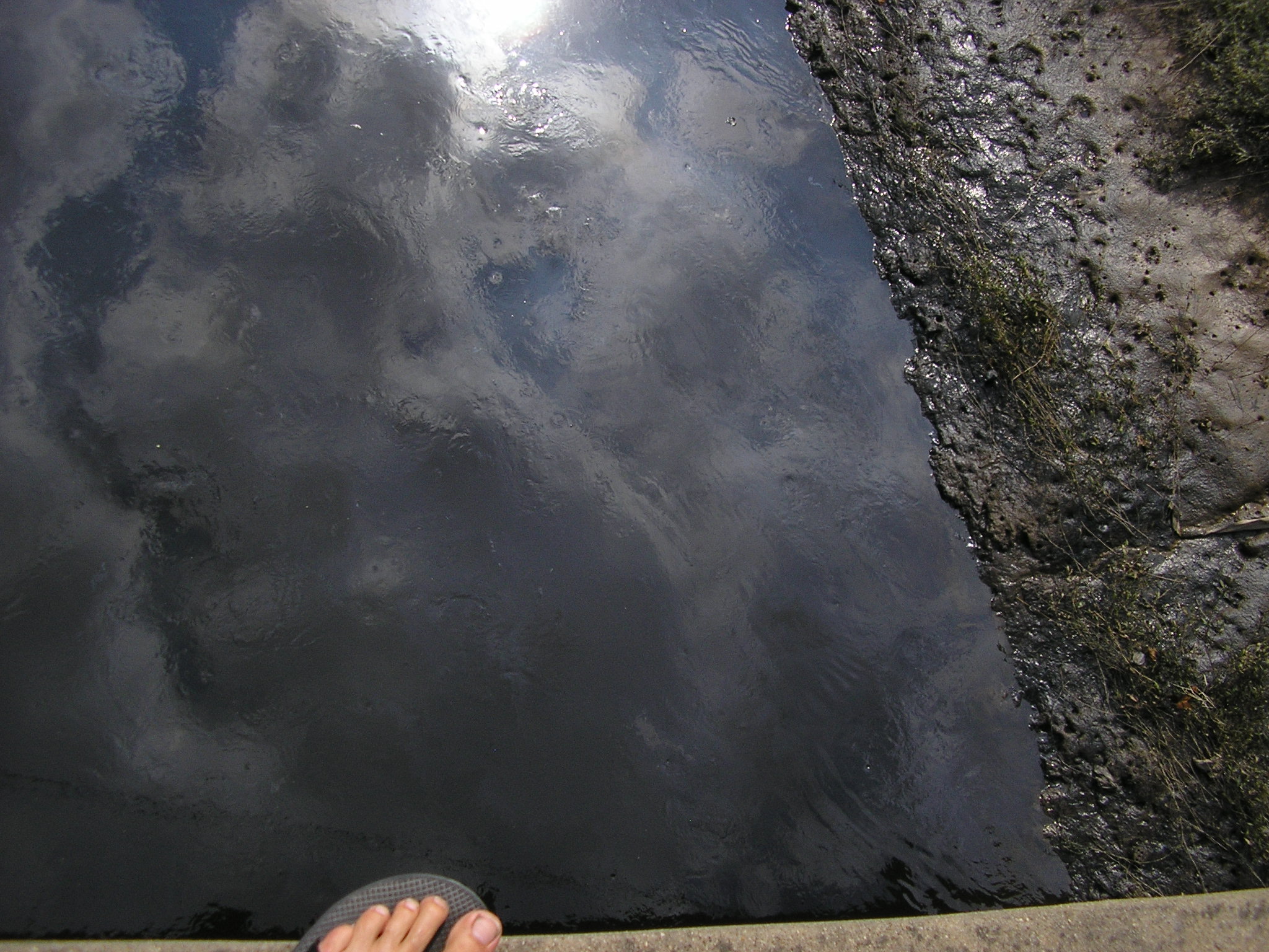 Oct 2007 - Part water, large part disel fuel and other chemicals, this creek flows unfiltered into the Yangze River.