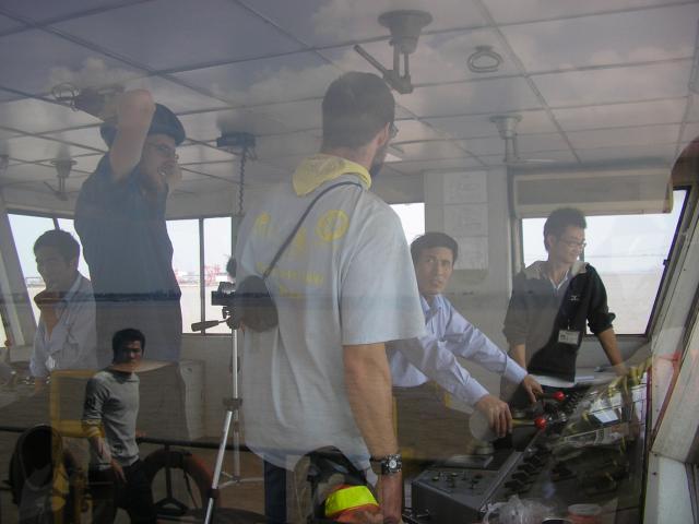 Oct 11 2007 - Crossing the Yangze River (Changjiang) Jim and Adam chatting with the ferry boat captain