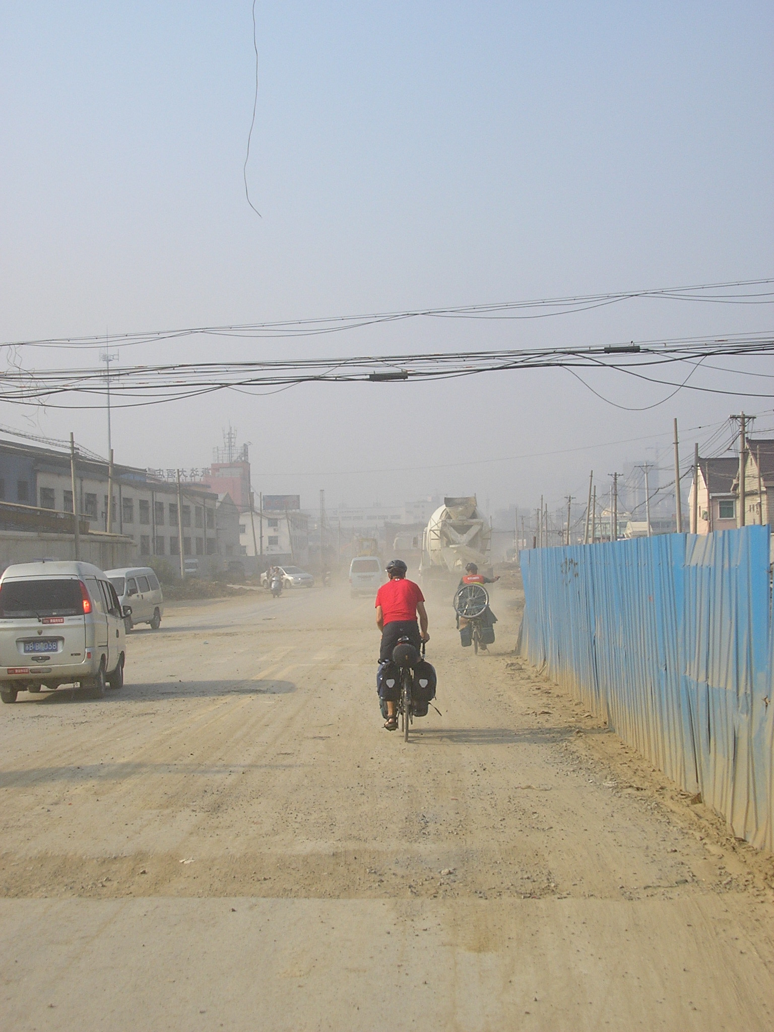 Oct 12 2007 - A rough road to start the day's ride to Suzhou City.