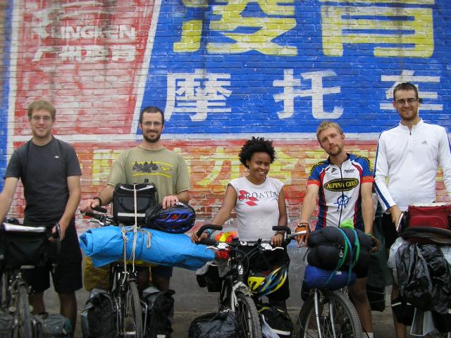 China, Hubei prov. - Sept 2007 - In front of an ad in the courtyard of our lunch restaurant.