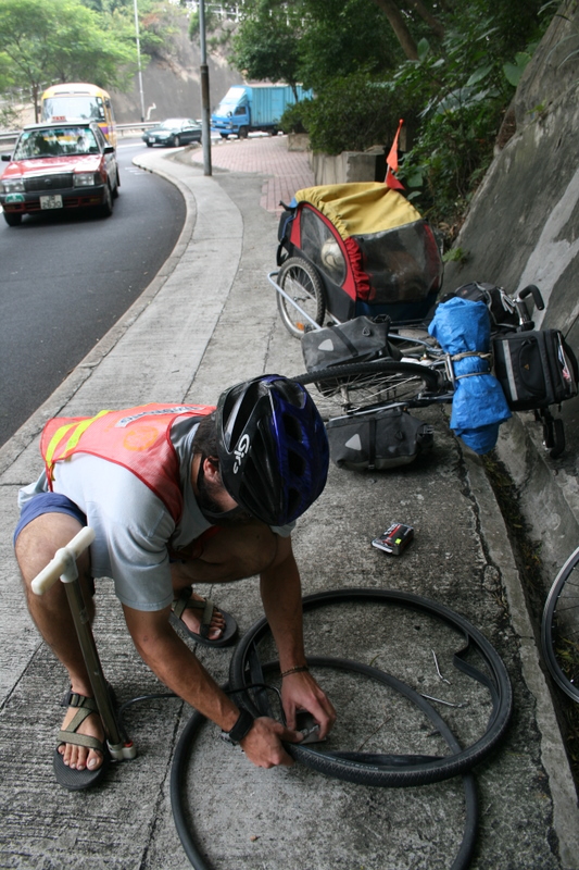 Hong Kong - Jim got a flat tire on the narrow, winding mountainous Stanley - Central road on our way out from Maryknoll to the Z