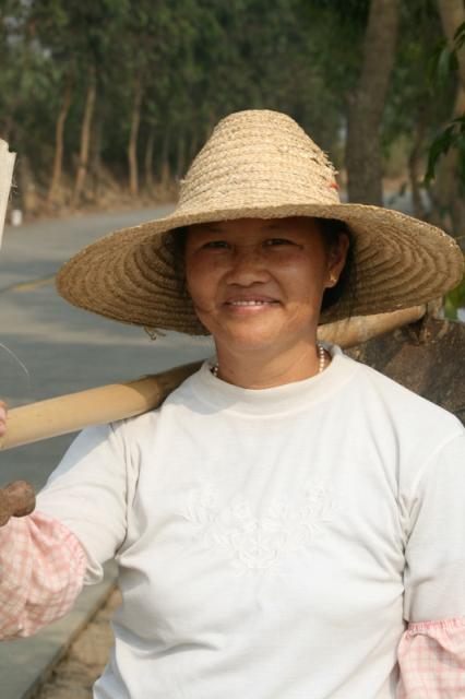 Guangdong - An enthusiastic farmer harvesting sugar cane, came up to chat and invite us down to the field.