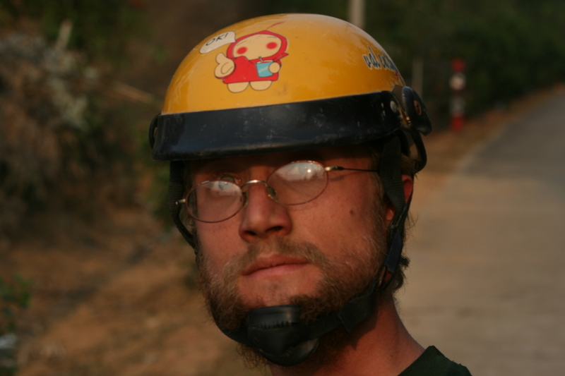 Wearing a motorcycle helmet he found on the road. (Taken by Peter)