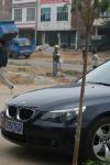 Western Guangxi, China - The BMW at lunch...The growing gap between China's rich and poor