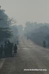 Lao - (Peter) Drew & Adam on the road during a smoky morning ride