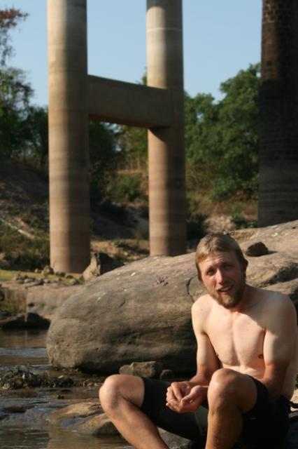 Lao - bathing in a river on a hot mid day