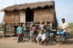 Cambodia - Mrs. Sre and us in front of her house. After asking if we could camp in her back yard, she and her husband (and neigh