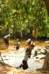 Cambodia - We invaded these children's swim hole one mid-day for our lunch and siesta stop. They didn't shy away from their usua