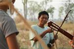 Cambodia - Camping in back of family Sre's, their neighbor turned out to be a great Er Hu player! Apparently also a common instr