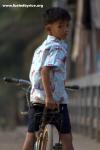 Cambodia - A fellow young bicyclist, in a small market town 40km north of Phnom Pehn.