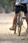 Cambodia - A fellow young bicyclist, in a small market town 40km north of Phnom Pehn.