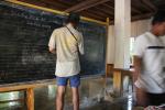 Cambodia - Jim teaching his part of our fueled by rice spontaneous English lesson in a Buddhist Monastery school.