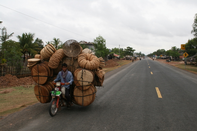 Cambodia - Basket load from the front.  Doesn't look too comfortable...