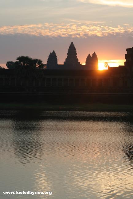 Cambodia - Angkor Wat at sunrise, moat in foreground
