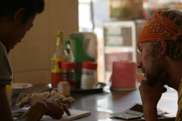 Cambodia - Drew takes time to help Yuske learn English at our lunch break.