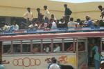 India, West Bengal - A bus in a small intersection town