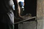 India, West Bengal - A cook making chapati (wheat tortila)