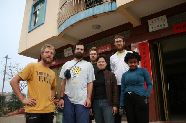 China - Guangdong Prov., With a guesthouse owner outside of her new building