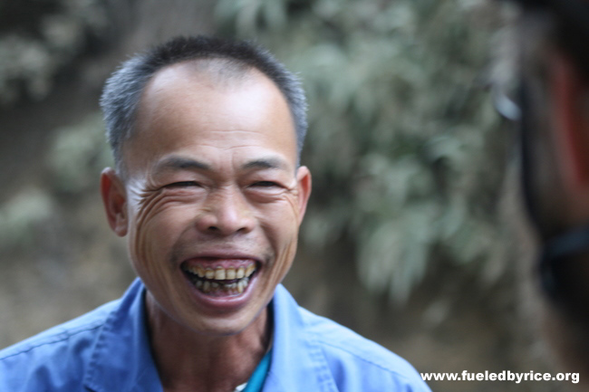 China, Guangxi prov - A very nice fellow cyclist enthusiastically chats with Adam (Peter)