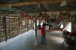 Nepal, Bhutanese Refugee Camp - The inside of the church where Mouikumar is pastor, where they allowe us to store our bikes over