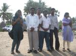 Part of the SCORD team stands on a beach in Tamil Nadu, observing the filming.
