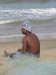 A fisherman sows his net.