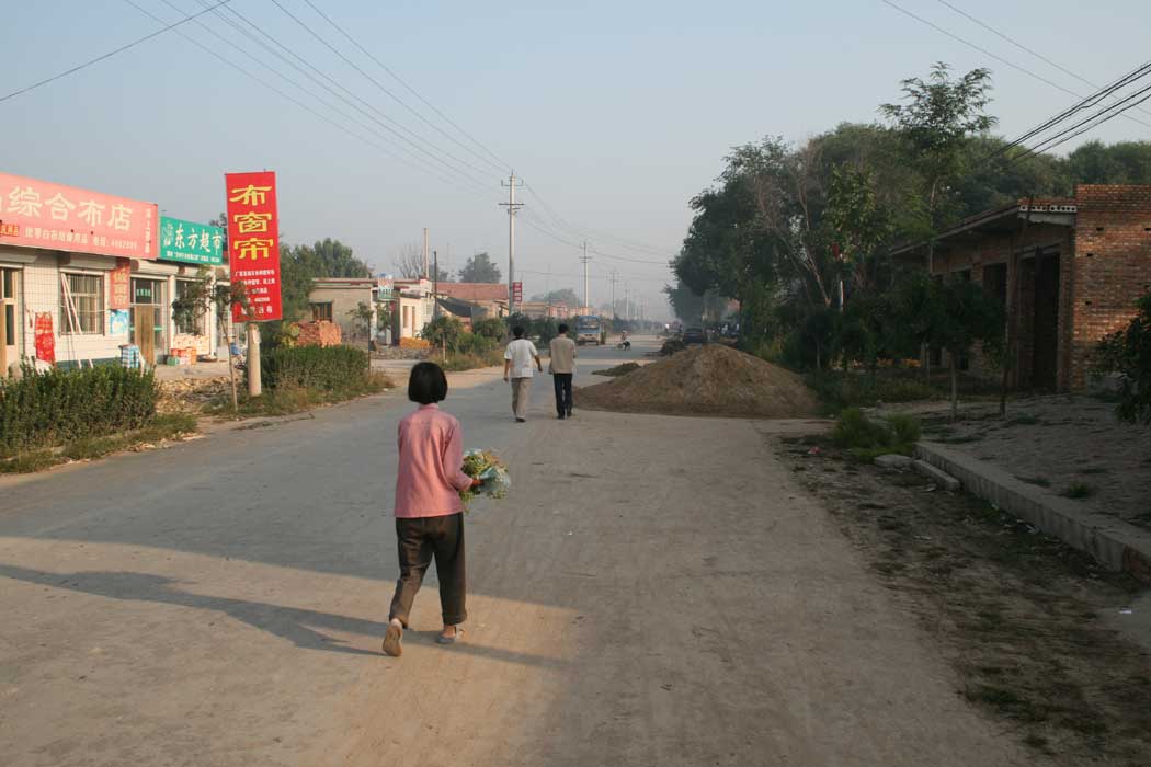 The Main Street of a small village, Shang Lin Xiang, where we spent the night.  There has been a lot of corn on the roads to dry