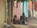 A dalit community resting beside thier new homes. They rallied the local panchayat president to replace the homes that were dest