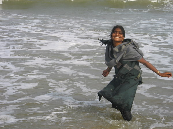 Rajilakshmi, SCORD staff, getting fresh with those frisky waves.