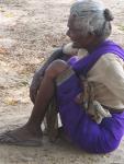 An old woman, listening.