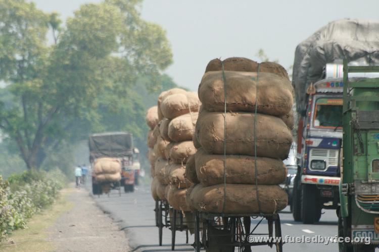 India, West Bengal - [Hear chaotic and deafening truck air horns that quickly change pitch back and forth] Indian Traffic! Back 