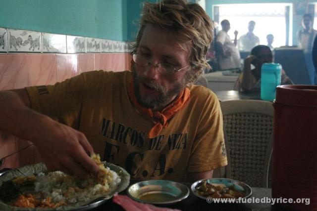 India, West Bengal - Drew eating lunch. In India, most people eat with their hands. With rice and dal, it certainly is a bit wet