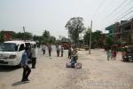 Nepal, east lowlands - Typical street scene in Nepali/India market town. People out and about- not just in cars, shops, dirt, ro