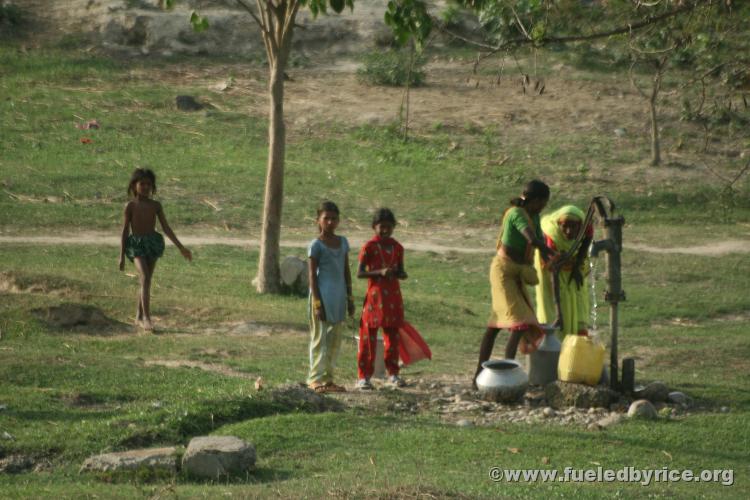 Nepal, east lowlands - A different lifestyle. Women & girls at the hand pump well. This is how most rural and small town peo