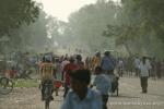 Nepal, east lowlands - FBR passing through small road-side market along main Hwy 1. Where's Drew & Jim?