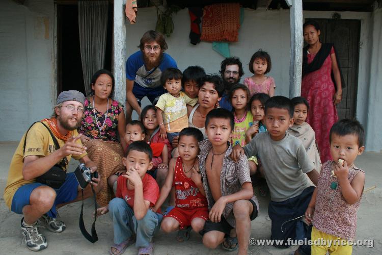 Nepal, east lowlands, Jamunibas village [homestay] - Group shot with our hosts (young mang white tank top center and woman betwe