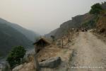 Nepal, Himalayan foothills, Sindhuli area - Andrew resorts (like we all did on hills like this) to walking the Bandwagon up. Jim