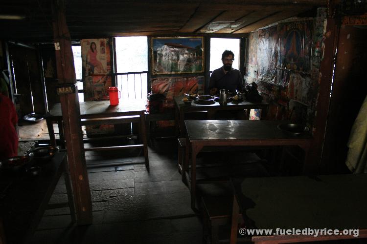 Nepal, Himalayan foothills, Sindhuli area - Jim in our breakfast restaurant that was hanging on flimsy stilts over the river val