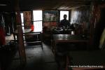 Nepal, Himalayan foothills, Sindhuli area - Jim in our breakfast restaurant that was hanging on flimsy stilts over the river val