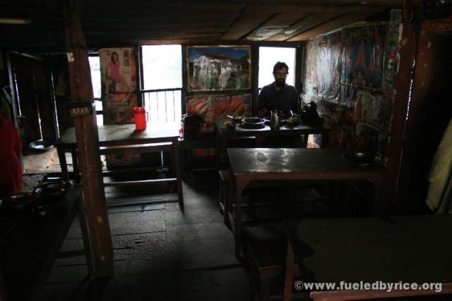 Nepal, Himalayan foothills, junction with Jiri-Kathmandu road - Jim in our breakfast restaurant that was hanging on flimsy stilt