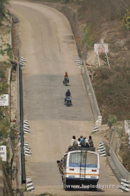 Nepal, Himalayan foothills day 1 - Jim & Drew taking our first taste of mountain riding in stride...with an audience [Peter]