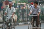 Nepal, Mahendranagar town - Some Nepali men dress traditionally, more western. Nearly all women dress traditionally in colorful 