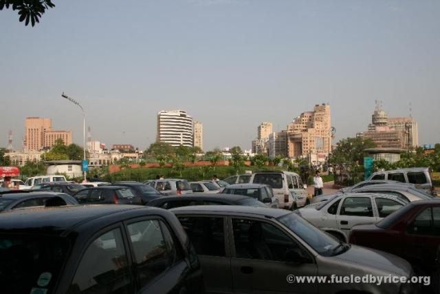 Indıa New Delhı - Canaught Place the physıcal center and maın shoppıng are of New Delhı.  Packed wıth sub-compact cars of the rı