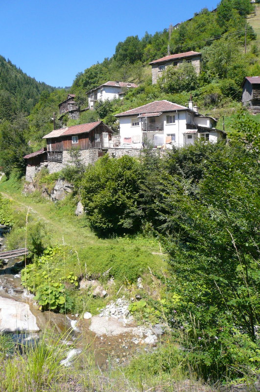 A house along the mountain road in Bulgaria. It is hot, but some shade and not as hot as the plains.